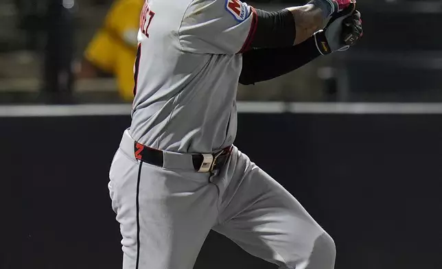 Cleveland Guardians' José Ramírez watches his two-run double off Tampa Bay Rays pitcher Ian Seymour during the second inning of a baseball game Friday, Sept. 5, 2025, in Tampa, Fla. (AP Photo/Chris O'Meara)