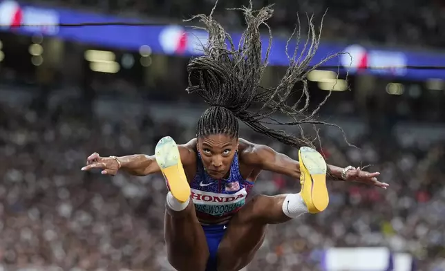 United States' Tara Davis-Woodhall competes in the women's long jump final at the World Athletics Championships in Tokyo, Sunday, Sept. 14, 2025. (AP Photo/Ashley Landis)