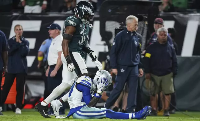Dallas Cowboys wide receiver CeeDee Lamb (88) grips his helmet after Lamb was unable to catch a pass late in the second half of an NFL football game against the Philadelphia Eagles Friday, Sept. 5, 2025, in Philadelphia. (AP Photo/Matt Slocum)