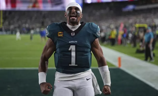 Philadelphia Eagles' Jalen Hurts motivates fans before an NFL football game against the Dallas Cowboys Thursday, Sept. 4, 2025, in Philadelphia. (AP Photo/Matt Slocum)