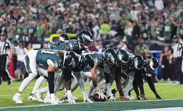 The Philadelphia Eagles defense celebrate after recovering a Dallas Cowboys fumble in the second half of an NFL football game Thursday, Sept. 4, 2025, in Philadelphia. (AP Photo/Matt Rourke)