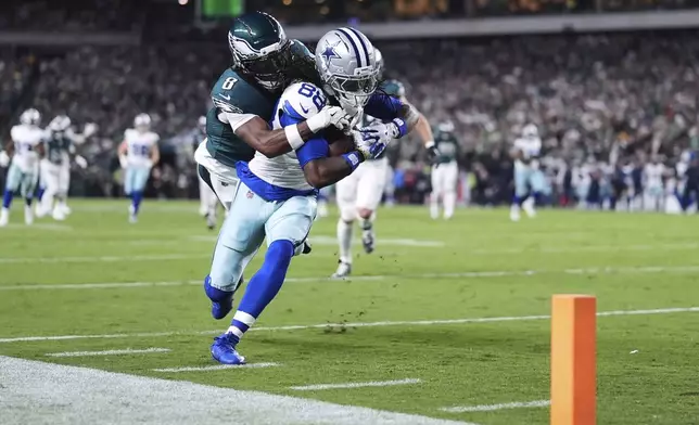 Dallas Cowboys wide receiver CeeDee Lamb (88) catches a pass and is stopped short of the end zone by Philadelphia Eagles cornerback Adoree' Jackson (8) in the first half of an NFL football game Thursday, Sept. 4, 2025, in Philadelphia. (AP Photo/Matt Slocum)
