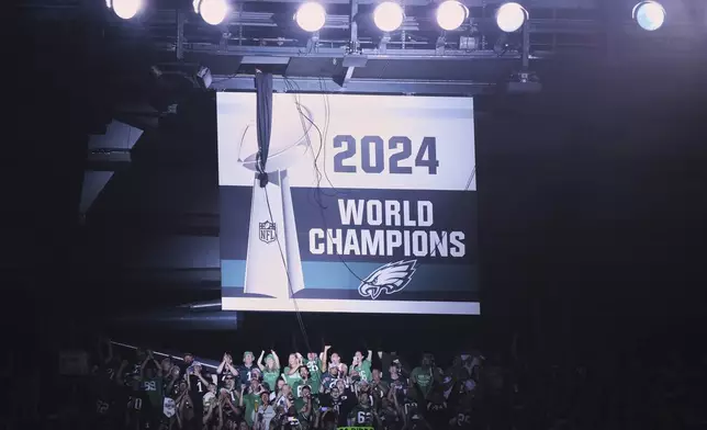 The Philadelphia Eagles 2024 championship banner is unveiled before an NFL football game against the Dallas Cowboys Thursday, Sept. 4, 2025, in Philadelphia. (AP Photo/Matt Slocum)