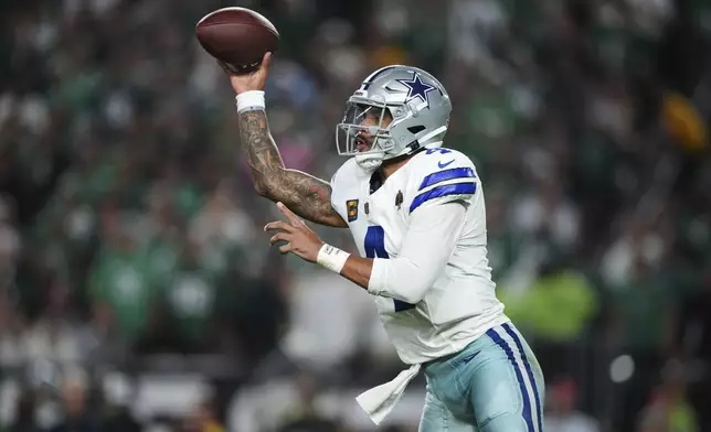 Dallas Cowboys quarterback Dak Prescott (4) throws a pass in the first half of an NFL football game against the Philadelphia Eagles Thursday, Sept. 4, 2025, in Philadelphia. (AP Photo/Matt Slocum)