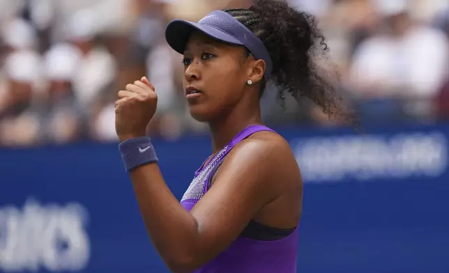 Naomi Osaka, of Japan, reacts during a match against Coco Gauff, of the United States, in the fourth round of the US Open tennis championships, Monday, Sept. 1, 2025, in New York. (AP Photo/Kirsty Wigglesworth)