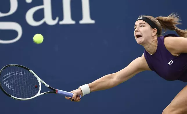 Karolina Muchova, of the Czech Republic, returns a shot to Soraya Cirstea, of Romania, during the second round of the U.S. Open tennis championships, Thursday, Aug. 28, 2025, in New York. (AP Photo/Andres Kudacki)