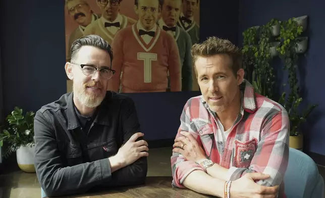 Colin Hanks, left, director of the documentary film "John Candy: I Like Me," poses with producer Ryan Reynolds for a portrait at The Second City comedy club to promote the film during the Toronto International Film Festival on Thursday, Sept. 4, 2025, in Toronto. (AP Photo/Chris Pizzello)