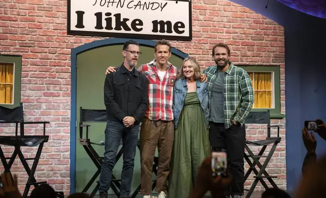Director Colin Hanks, producer Ryan Reynolds, and John Candy's children Jennifer and Christopher Candy pose for a photo at a press conference for the film John Candy: I Like Me, prior to the film's premiere, at the Toronto International Film Festival, in Toronto on Thursday, September 4, 2025. (Arlyn McAdorey/The Canadian Press via AP)