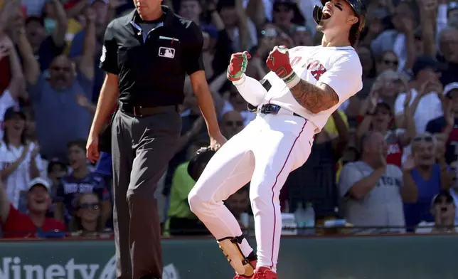 Boston Red Sox's Jarren Duran reacts after hitting a three-run in field home run during the fifth inning of a baseball game against the Pittsburgh Pirates, Sunday, Aug. 31, 2025, in Boston. (AP Photo/Mark Stockwell)