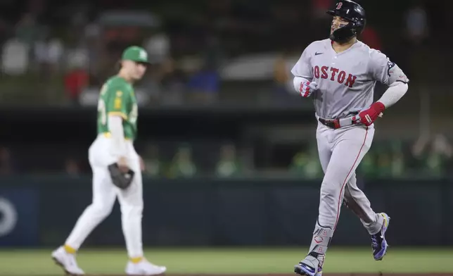 Boston Red Sox's Carlos Narváez, right, jogs around the bases after hitting a solo home run during the fifth inning of a baseball game against the Athletics, Monday, Sept. 8, 2025, in West Sacramento, Calif. (AP Photo/Scott Marshall)