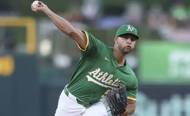 Athletics pitcher Luis Morales throws to an Boston Red Sox batter during the first inning of a baseball game Monday, Sept. 8, 2025, in West Sacramento, Calif. (AP Photo/Scott Marshall)