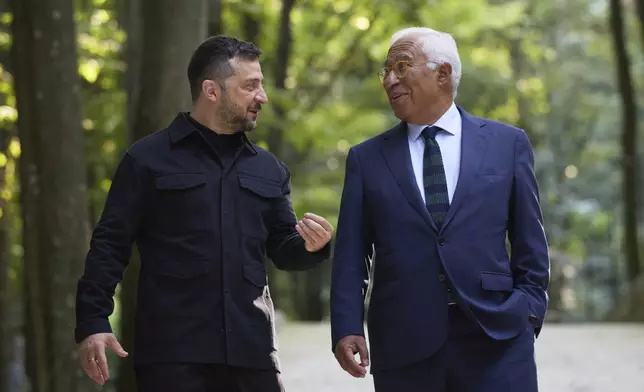 In this photo provided by the Ukrainian Presidential Press Office, Ukrainian President Volodymyr Zelenskyy, left, and European Council President Antonio Costa talk in Uzhhorod, Ukraine, Friday, Sept. 5 2025. (Ukrainian Presidential Press Office via AP)