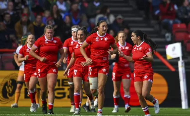 Canada's celebrates a try during the Women's Rugby World Cup 2025 quarterfinal match between Canada and Australia, in Bristol, England, Saturday, Sept. 13, 2025. (AP Photo/Anthony Upton)