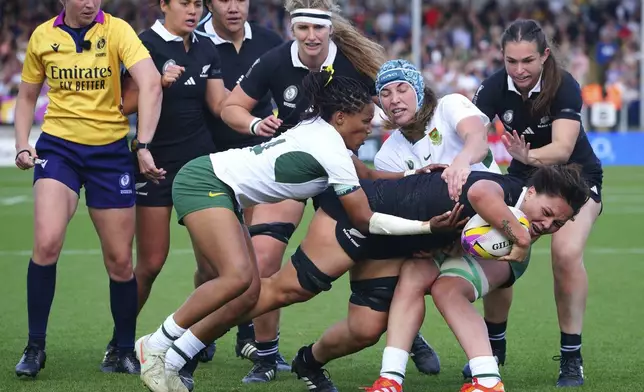 New Zealand's Kaipo Olsen-Baker scores their side's fifth try of the game during the Women's Rugby World Cup 2025 quarter-final match at Sandy Park, Exeter, England, Saturday Sept. 13, 2025. (Ben Birchall/PA via AP)