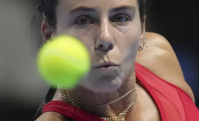 Emma Navarro, of the United States eyes on the ball as she plays against Yulia Putintseva, of Kazakhstan during the Billie Jean King Cup quarterfinals tennis match, at the Shenzhen Bay Sports Center Arena, in Shenzhen, China's Guangdong province, Thursday, Sept. 18, 2025. (AP Photo/Andy Wong)