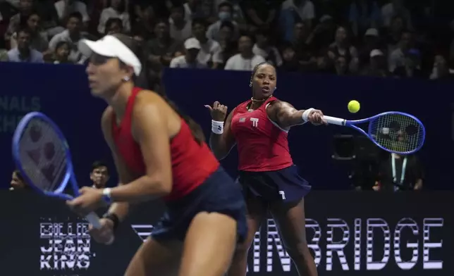 Taylor Townsend and Jessica Pegula, of the United States play against Elena Rybakina and Yulia Putintseva, of Kazakhstan during the Billie Jean King Cup quarterfinals tennis doubles match, at the Shenzhen Bay Sports Center Arena, in Shenzhen, China's Guangdong province, Thursday, Sept. 18, 2025. (AP Photo/Andy Wong)