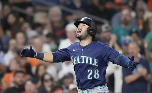 Seattle Mariners' Eugenio Suárez runs the bases after hitting a solo home run during the fourth inning of a baseball game against the Houston Astros, Friday, Sept. 19, 2025, in Houston. (AP Photo/Kevin M. Cox)