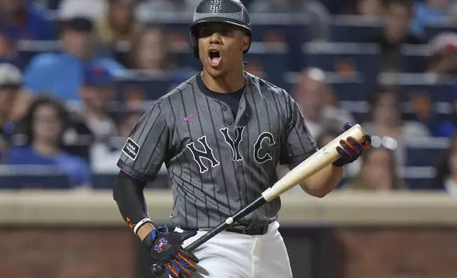 New York Mets' Juan Soto reacts after striking out in the 11th inning of a baseball game against the Washington Nationals Saturday, Sept. 20, 2025, in New York. (AP Photo/Frank Franklin II)