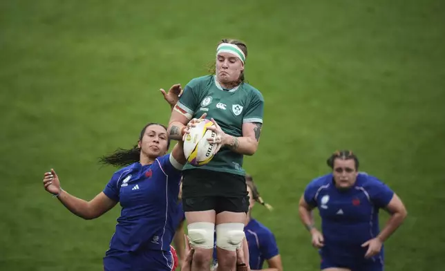 Ireland's Ruth Campbell, top, wins a line out against France's captain Mane Feleu during a Women's Rugby World Cup 2025 quarterfinal match between France and Ireland, in Exeter, England, Sunday, Sept. 14, 2025. (AP Photo/Alastair Grant)