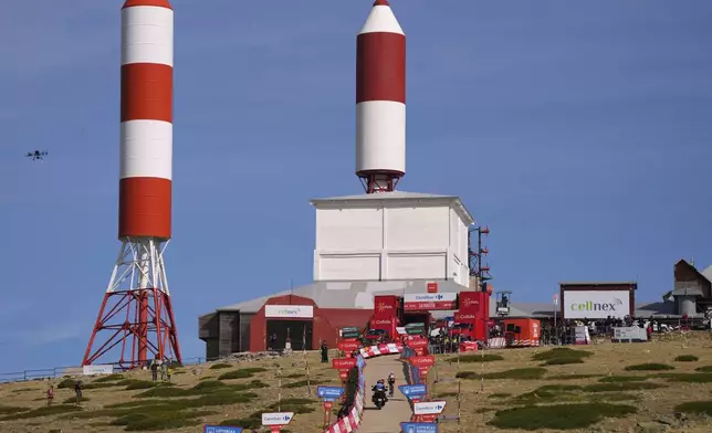 Danish cyclist Jonas Vingegaard completes the final meters before winning the 20th stage and his first overall victory in the Spanish cycling race La Vuelta, from Robledo de Chavela to Bola del Mundo, in Puerto de Navacerrada, Spain, on Saturday, September 13, 2025. (AP Photo/Manu Fernández)