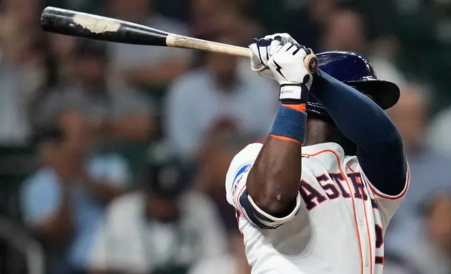 Houston Astros' Taylor Trammell hits a double off of New York Yankees relief pitcher David Bednar during the ninth inning of a baseball game Thursday, Sept. 4, 2025, in Houston. (AP Photo/Karen Warren)