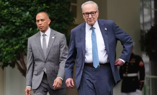Senate Minority Leader Chuck Schumer, D-N.Y., right, and House Minority Leader Hakeem Jeffries, D-N.Y., walk speak to members of the media outside the West Wing at the White House in Washington, Monday, Sept. 29, 2025, in Washington. (AP Photo/Evan Vucci)