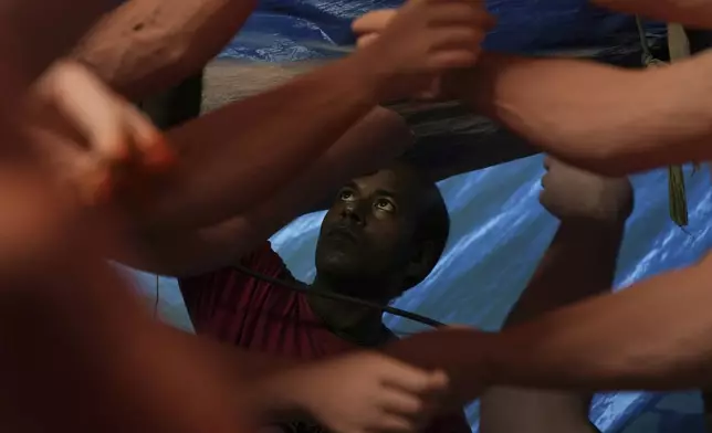 An artist from Kolkata paints an idol of the Hindu goddess Durga ahead of the Durga Puja festival in New Delhi, India, Friday, Sept. 19, 2025. (AP Photo/Manish Swarup)