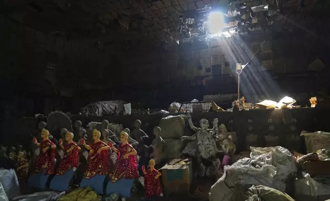 Idols of Hindu goddess Durga are kept for transportation ahead of the Durga Puja festival in New Delhi, India, Saturday, Sept. 20, 2025 (AP Photo/Manish Swarup)