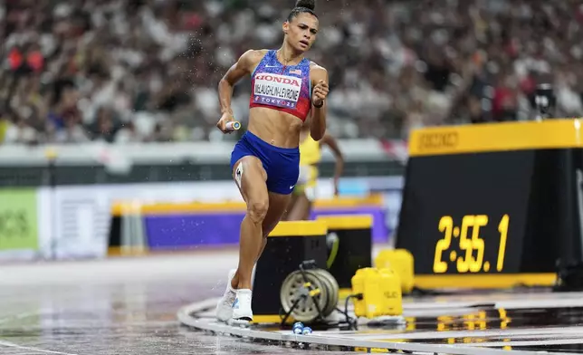 United States' Sydney McLaughlin-Levrone competes in the women's 4 X 400 meters relay at the World Athletics Championships in Tokyo, Sunday, Sept. 21, 2025. (AP Photo/Ashley Landis)