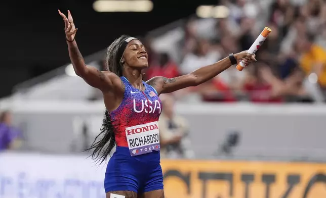United States' Sha'Carri Richardson reacts after winning the women's 4 X 100 meters relay at the World Athletics Championships in Tokyo, Sunday, Sept. 21, 2025. (AP Photo/Eugene Hoshiko)