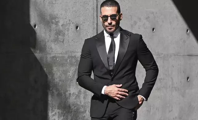 Spanish actor Miguel Angel Silvestre leaves the Armani/Teatro in Milan, northern Italy, after paying his respects to designer Giorgio Armani, who died in Milan on Thursday at age 91. Saturday, Sept. 6, 2025.(AP Photo/Nicola Marfisi)
