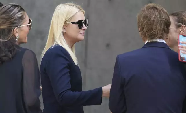 Valeria Mazza arrives at the Armani/Teatro in Milan, northern Italy, Saturday, Sept. 6, 2025, to pay respects to fashion designer Giorgio Armani who died Thursday at age 91. (AP Photo/Antonio Calanni)