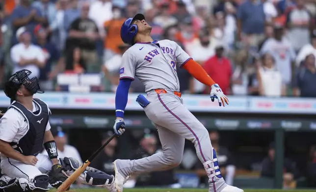 New York Mets' Juan Soto, right, reacts in front of Detroit Tigers catcher Jake Rogers after flying out to left fielder Riley Greene for the final out of a baseball game, Wednesday, Sept. 3, 2025, in Detroit. (AP Photo/Ryan Sun)