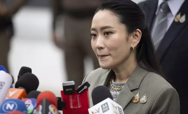 Former Prime Minister Paetongtarn Shinawatra, daughter of former Prime Minister Thaksin Shinawatra talks to reporters at the Supreme Court in Bangkok, Thailand, Tuesday, Sept. 9, 2025. (AP Photo/Wason Wanichakorn)