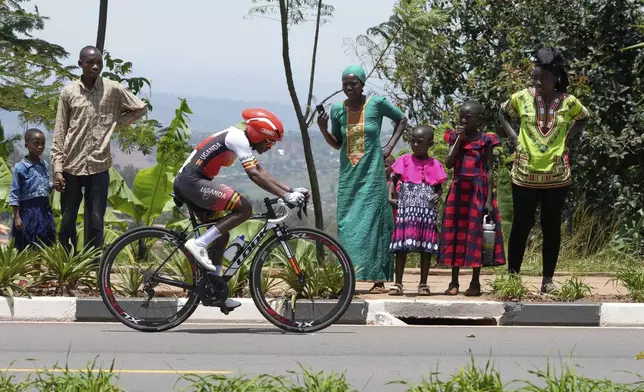 Uganda's Namukasa Trinitah competes, during the women's elite individual time trial event, at the road cycling World Championships in Kigali, Rwanda, Sunday, Sept. 21, 2025. (AP Photo/Jerome Delay)