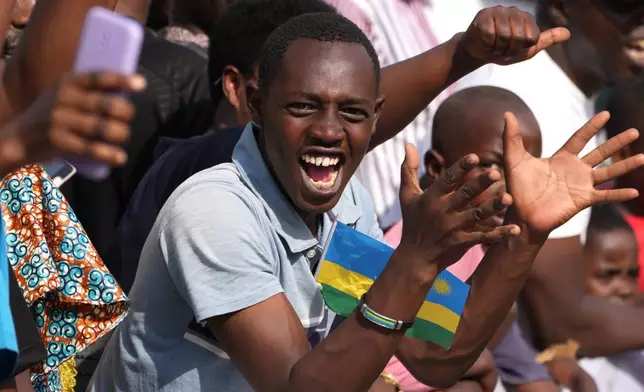 Spectators cheer during the men's Under 23 road race, at the road cycling World Championships in Kigali, Rwanda, Friday, Sept. 26, 2025. (AP Photo/Jerome Delay)