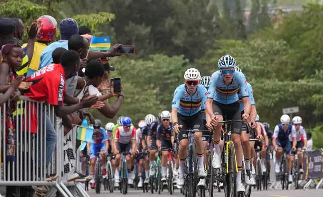 The Belgian team leads the pack during the men's Under 23 road race, at the road cycling World Championships in Kigali, Rwanda, Friday, Sept. 26, 2025. (AP Photo/Jerome Delay)