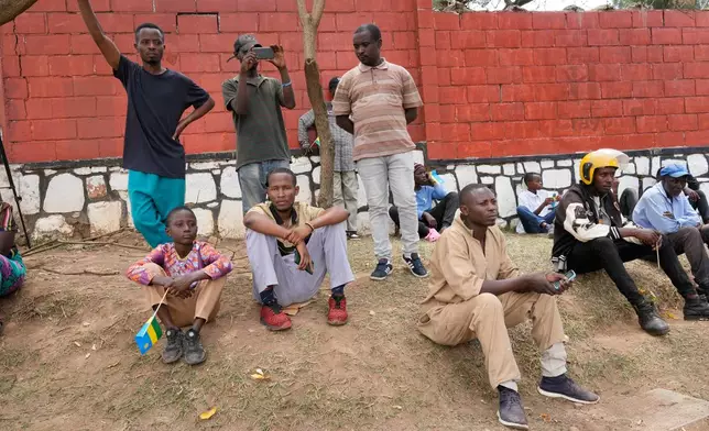 Spectators watch the men's Under 23 road race, at the road cycling World Championships in Kigali, Rwanda, Friday, Sept. 26, 2025. (AP Photo/Jerome Delay)