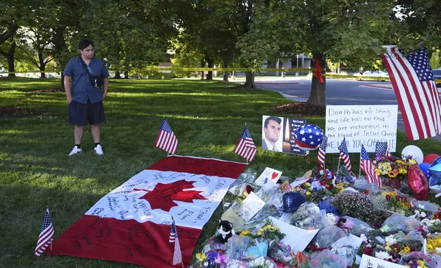 Utah Valley University student Alec Vera stands near a memorial for Charlie Kirk on Friday, Sept. 12, 2025, in Orem, Utah. (AP Photo/Lindsey Wasson)