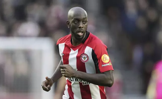 FILE - Yoane Wissa of Brentford chases the ball during the English Premier League soccer match between Brentford and Aston Villa, at the Gtech Community Stadium in London, Sunday, Dec. 17, 2023. (AP Photo/Dave Shopland, File)