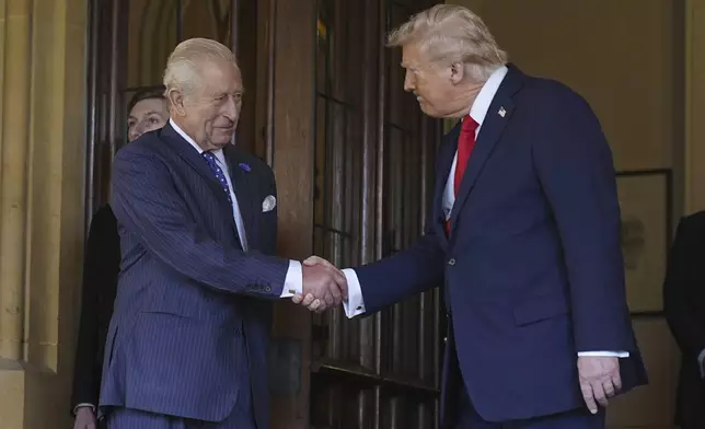 Britain's King Charles III, left, formally bids farewell to US President Donald Trump at Windsor Castle, Windsor, England, Thursday Sept. 18, 2025. (Aaron Chown/Pool Photo via AP)