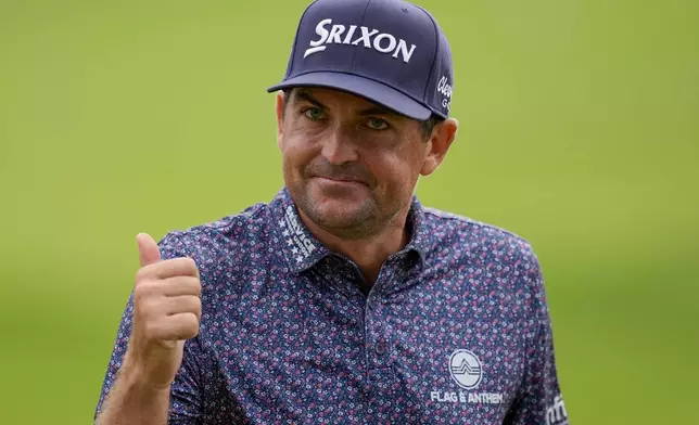 Keegan Bradley reacts to his putt on the 18th green during the third round of the Tour Championship golf tournament, Saturday, Aug. 23, 2025, in Atlanta. (AP Photo/Mike Stewart)