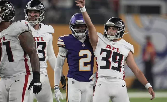 Atlanta Falcons place-kicker Parker Romo (39) celebrates a field goal during the second half of an NFL football game against the Minnesota Vikings, Sunday, Sept. 14, 2025, in Minneapolis. (AP Photo/Mike Stewart)