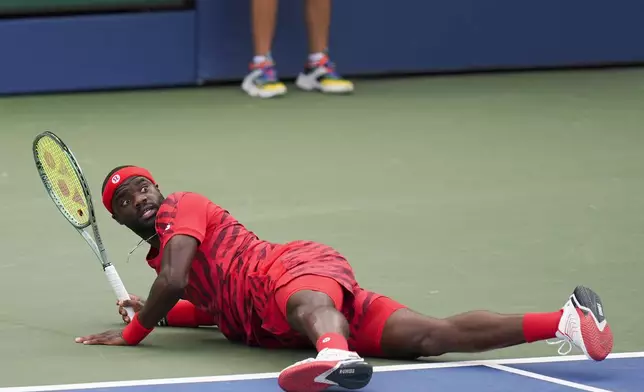 Frances Tiafoe, of the United States, watches his return shot to Jan-Lennard Struff, of Germany, during the third round of the U.S. Open tennis championships, Friday, Aug. 29, 2025, in New York. (AP Photo/Seth Wenig)