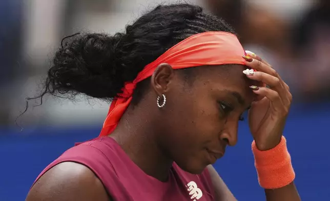Coco Gauff, of the United States, reacts during a match against Naomi Osaka, of Japan, during the fourth round of the US Open tennis championships, Monday, Sept. 1, 2025, in New York. (AP Photo/Kirsty Wigglesworth)