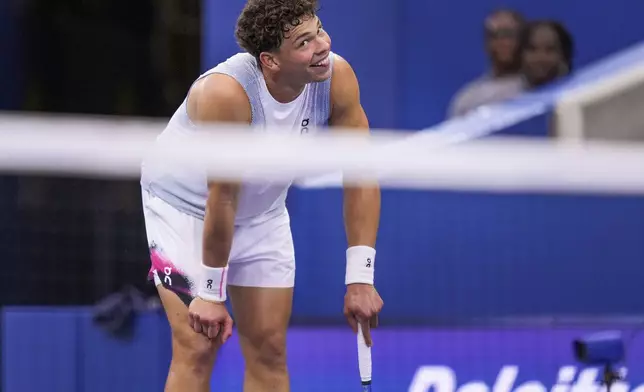 Ben Shelton, of the United States, reacts after a rally against Adrian Mannarino, of France, during the third round of the U.S. Open tennis championships, Friday, Aug. 29, 2025, in New York. (AP Photo/Kirsty Wigglesworth)