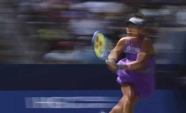 Naomi Osaka, of Japan, returns a shot againts Daria Kasatkina, of Australia, during the third round of the U.S. Open tennis championships, Saturday, Aug. 30, 2025, in New York. (AP Photo/Heather Khalifa)