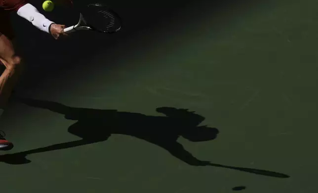 Jannik Sinner, of Italy, returns a shot against Denis Shapovalov, of Canada, during the third round of the U.S. Open tennis championships, Saturday, Aug. 30, 2025, in New York. (AP Photo/Kirsty Wigglesworth)