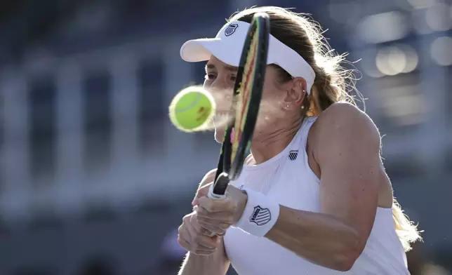 Ekaterina Alexandrova, of Russia, returns a shot against Laura Siegemund, of Germany, during the third round of the U.S. Open tennis championships, Saturday, Aug. 30, 2025, in New York. (AP Photo/Adam Hunger)