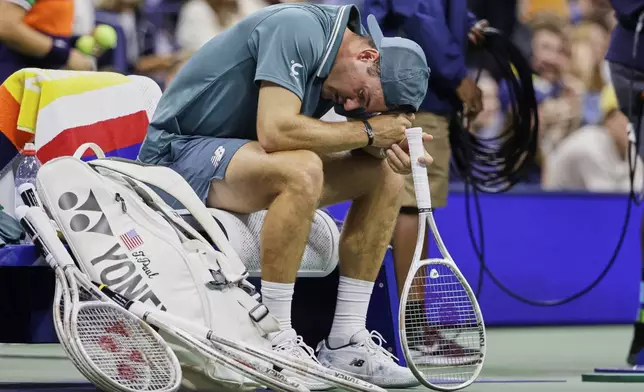 Tommy Paul, of the United States, reacts after losing the third set against Alexander Bublik, of Kazakhstan, during the third round of the U.S. Open tennis championships, Saturday, Aug. 30, 2025, in New York. (AP Photo/Adam Hunger)
